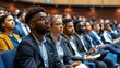 © AdriFerrer - A group of people are sitting in a room, some wearing glasses