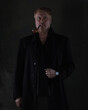 © serikbaib - portrait of an old red-haired man in a black jacket