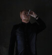 © serikbaib - portrait of an old red-haired man in a black jacket