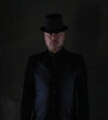 © serikbaib - portrait of an old man in a black hat and black jacket