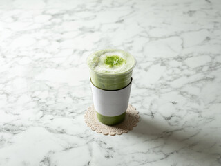 Wall Mural - Cool green tea latte in a cup