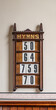 Wooden hymn board with four numbers to give order of religious songs and prayers.
