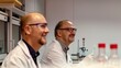 Authentic smiling scientists laboratory coats wearing safety glasses working in a modern laboratory background 