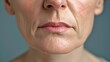 Close-up of a mature woman's lower face showing signs of aging. Skin texture and lips detail captured in a neutral style. Perfect for healthcare visuals. AI