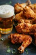 beer and fried chicken legs close-up