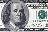 Fototapeta Storczyk - Benjamin Franklin close up face from us hundred dollar bill. United States national currency banknote fragment