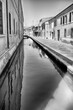 Walking among the picturesque canals of Comacchio, Italy
