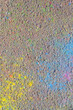 Directly above on explosion of multicolor holi powder on asphalt background
