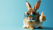 Rabbit wearing sunglasses giving thumbs up. Cute rabbit with sunglasses on a blue background giving a thumbs up pose. AI generative.