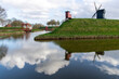 Panoramic view over rampart with mill and canal with reflection of the village of Bourtange (former Fort Bourtange), near Westerwolde the Netherlands; the fortress was built in 1593 shape of a star 