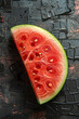 Ripe and juicy watermelon slice clon dark textured background.