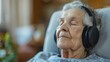 Senior woman wearing headphones receiving sound therapy for balance and overall well-being. Concept Sound Therapy, Senior Health, Wellness, Balance, Headphones, Aging Gracefully