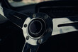 Old car sport steering wheel close up