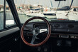 Old classic car interior with a steering wheel 