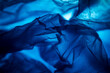 Extreme close up of blue empty plastic bag background.