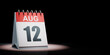 August 12 Calendar Spotlighted on Black Background