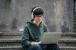 A young man wearing headphones