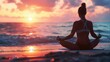 © Supachai - A serene scene of a woman practicing yoga meditation on a beach during a breathtaking sunset.