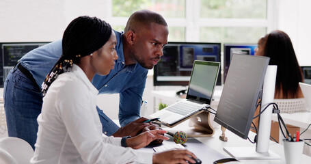 African Business Team Working On Computer
