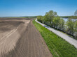 dusty rural road along the Missouri River near WIlton, MO, springtime aerial view