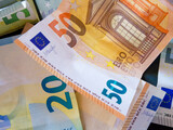 Fototapeta Morze - European Money Detail. Detailed shot of Euro banknotes, showcasing the €20 and €50 denominations.