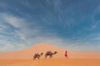 Berber with his dromedary in the sahara desert in Morocco