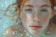 Young red-haired woman with very white skin in pool