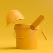 Set of safety helmet, bucket with paint rollers and brushes on monochrome.