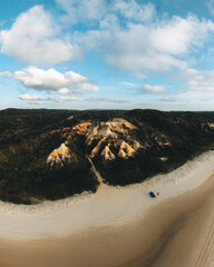 Wall Mural - aerial drone view of the pinnacles, colored sands on fraser island, sunrise with car. kgari, queensl