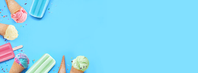 Aufkleber - Assorted colorful pastel ice cream cones and popsicle summer frozen desserts. Top view corner border on a blue banner background. Copy space.