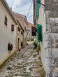 Narrow cobbled alley leading to the Church of the Assumption of Mary in Hum, known as the smallest town in the world. Municipality of Buzet, Istria, Croatia, Europe