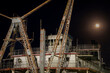 Detail of vintage river dredge on a shore of the Missouri River, night view with full moon.