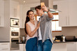 © peopleimages.com - Couple, home kitchen and selfie with phone for profile picture together, social media post and digital gallery. Apartment, woman smile and man for photo on mobile with happy memory, relax and love