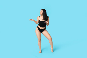 Sticker - Body positive young woman in underwear on blue background