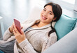 Asian, gen z and relax with smartphone on sofa for streaming, social media and communication. Networking, email and technology in apartment for connection, conversation and mobile app in house.