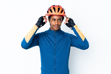 Wall Mural - Young cyclist man with braids over isolated background having doubts and thinking