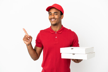 Wall Mural - African American pizza delivery man picking up pizza boxes over isolated white wall showing and lifting a finger in sign of the best