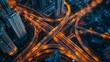 © Plaifah - An overhead view of a busy highway interchange illuminated by city lights at night, symbolizing the constant flow of urban traffic.