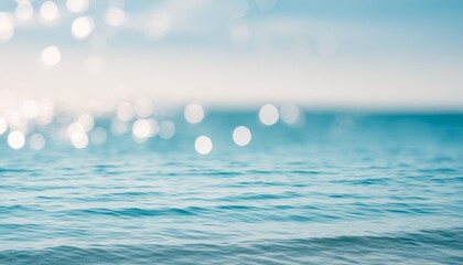 Wall Mural - the smooth natural blue water background with bokeh abstract on the sea or ocean vintage and soft colored blur