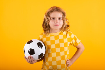 Wall Mural - Kid holding football ball in studio. Kid playing football. Sport, soccer hobby for kids. Little boy holding soccer ball. Fan sport boy football player with football ball.