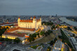 Bratislava castle on the hill over Danube river at twilight, Slovakia