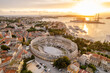 Aerial view of the historic Roman Amphitheatre of Pula at sunset, Croatia