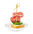 Tasty canape with salami, cucumber and cream cheese isolated on white