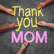 Mothers day Thank you message in chalk writing on street pavement as a celebration for moms and mommy love as a parenting appreciation