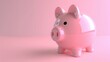 © WACHI - A pink piggy bank sits on a pink background. The piggy bank is empty and waiting to be filled with money. The piggy bank is a symbol of saving money.
