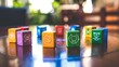 Colorful plastic toy blocks arranged in a circle on a table, each block featuring symbols of diversity