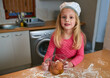 Young girl, baking and portrait in kitchen with flour on nose for growth, learning and development at home. Female child, messy and cooking in house for education, fun and excitement in lesson