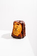 Caneles de bordeaux - traditional French sweet dessert with white table background.