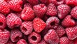 Background of fresh sweet red raspberries arranged together representing concept of healthy diet	