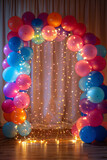 Fototapeta  - A balloon arch adorned with fairy lights woven through the balloons, creating a dazzling and luminous display for parties or celebrations.
